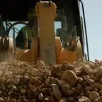 A close up of a tractor on top of rocks