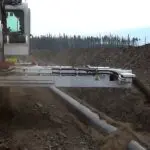 A large machine is digging into the ground
