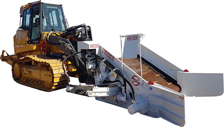 A yellow and black tractor with a white trailer