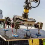 A robot is working on solar panels.
